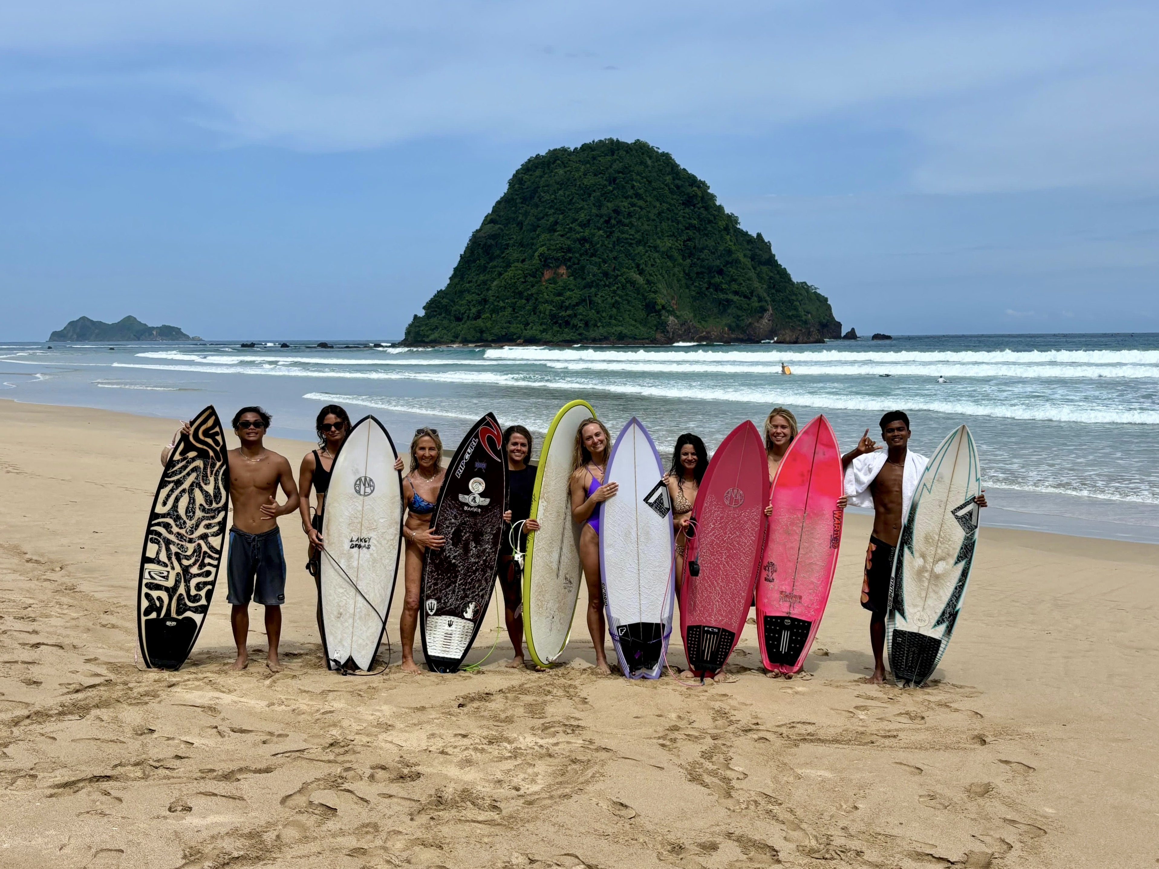 Group of surfers on a boat
